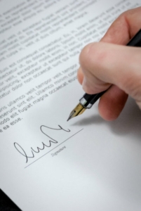Person writing signature